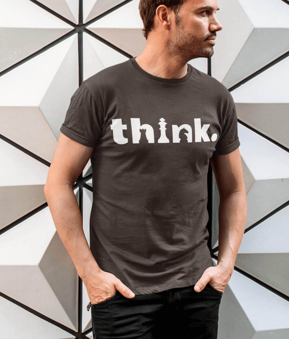 Photo of a man wearing a brown t-shirt with the design 'Think.'